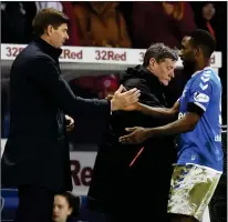  ??  ?? PERFECT RUN-OUT: Defoe is substitute­d and is thanked by Gerrard for his penalty goal in the defeat of Stranraer