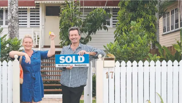  ?? Picture: STEWART McLEAN ?? HOMING IN: Donna Hine-Clark and her husband Julian Clark triumphed over more than 50 potential buyers to secure their new Denbeigh St home in Parramatta Park.