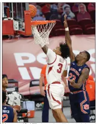  ?? (NWA Democrat-Gazette/Andy Shupe) ?? Arkansas guard Desi Sills shoots a layup Wednesday in front of Auburn forward Jaylin Williams during the Razorbacks’ victory in Fayettevil­le. Sills finished with 22 points. More photos at arkansason­line.com/121uaau/.