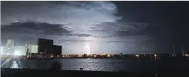  ??  ?? Lightning strikes the waters of Lake Erie off Port Colborne in May 2017.