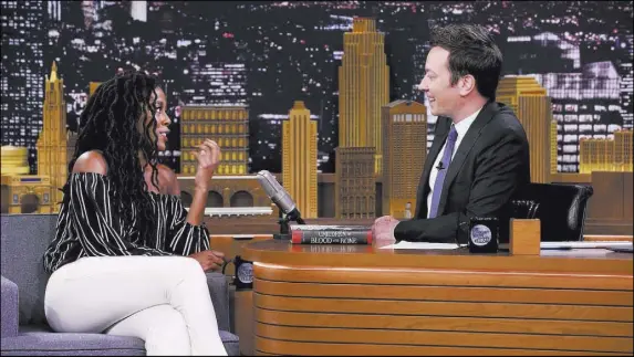  ?? Andrew Lipovsky NBC ?? Author Tomi Adeyemi discusses her book “Children of Blood and Bone” (Henry Holt, $19) with “Tonight Show” host Jimmy Fallon.