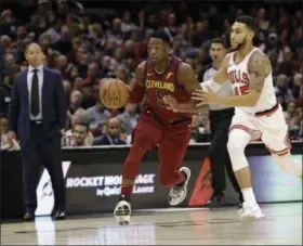  ?? TONY DEJAK — THE ASSOCIATED PRESS ?? The Cavaliers’ Dwyane Wade drives against the Bulls’ Denzel Valentine in the first half of the Cavaliers’ win over the Bulls on Oct. 24 at Quicken Loans Arena.