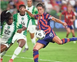  ?? ERICH SCHLEGEL/USA TODAY SPORTS ?? United States forward Carli Lloyd takes a shot against Nigeria’s Michelle Alozie (22) during an internatio­nal friendly June 16.