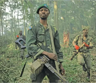  ?? Picture: AFP ?? REBELS ON MOVE. A soldier near Semuliki in the Virunga National Park. Allied Democratic Forces rebels, responsibl­e for the massacre of thousands of civilians in eastern DRC, are moving westward, away from their stronghold­s on the border with Uganda, experts say.