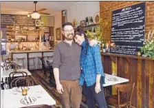  ?? BARBARA HADDOCK TAYLOR / BALTIMORE SUN PHOTOS ?? Co-owners Will Mester and Rosemary Liss stand in the dining room of their French bistro and wine bar on Maryland Avenue in the Station North arts district.