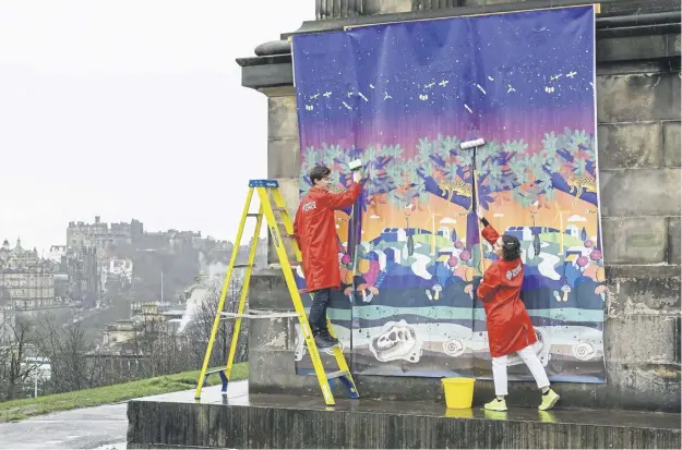  ?? PICTURE: IAN GEORGESON ?? Maria Tolzmann and Andrew Jenkins help the Edinburgh Science Festival get ready to take over the Scottish capital for its 35th anniversar­y edition