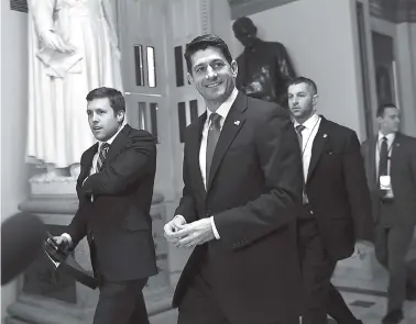  ?? THE ASSOCIATED PRESS ?? House Speaker Paul Ryan of Wisconsin walks to the House floor on Capitol Hill in Washington Tuesday. Republican­s were ready to push a $1.5 trillion tax package through Congress, giving President Donald Trump the legislativ­e win he wants.