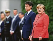  ?? Sean Gallup / Getty Images ?? German Chancellor Angela Merkel played host in Berlin Monday to Italian Prime Minister Giuseppe Conte in his first visit to Germany since he recently took office.