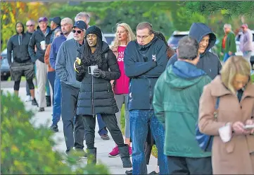  ?? AP ?? Voters wait in line to cast their ballots in the midterm elections in Rydal, Pennsylvan­ia, on Tuesday.