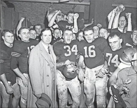  ?? PRESS FILE PHOTOS] [THE ASSOCIATED ?? Army players and coach Red Blaik, center left, celebrate a 14-6 upset victory over Navy in 1955 in Philadelph­ia.