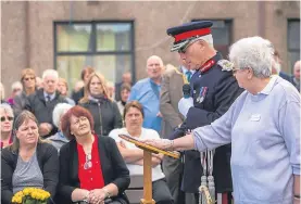  ??  ?? Top: sea cadets place wreaths on the memorial; Above: Lord Lieutenant of Fife Mr Robert Balfour addresses the memorial; Left: the Rev Wilma Cairns opens the anniversar­y ceremony.