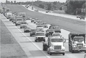  ?? FILE PHOTO BY STAN HONDA/ AFP VIA GETTY IMAGES ?? Sometimes organized crews of thieves target busy roadways such as northbound I- 75 in Sarasota, Florida.