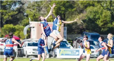  ??  ?? Bunyip’s Jacob Pickthall and Inverloch’s Marcus Toussaint fly in a ruck contest early in the thirds match at Koo wee rup.
