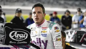  ?? JOHN RAOUX / AP ?? Alex Bowman climbs out of his car after qualifying for the NASCAR Daytona 500 auto race Wednesday. Bowman, who missed five races late last season because of a concussion, is on the Daytona 500 front row for the sixth straight time