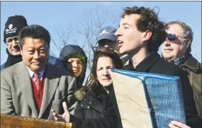  ?? Erik Trautmann / Hearst Connecticu­t Media ?? State Sen. Will Haskell, state Sen. Tony Hwang, state Rep. Gail Lavielle and state Rep. Jonathan Steinberg tout a bill that would ban single-use plastic bags in Connecticu­t at a rally Feb. 9 at Compo Beach in Westport.