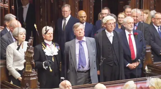  ??  ?? From left: Britain's Prime Minister Theresa May, David Leakey, Gentleman Usher of the Black Rod, Father of the House Kenneth Clarke and leader of the opposition Labour leader Jeremy Corbyn take part in the swearing in ceremony in the House of Lords in...