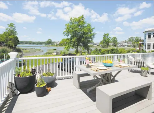  ?? Halstead Property / Contribute­d photo ?? At 18-by-36 feet in dimension, the deck at 187 Shore Road, Greenwich, runs the entire width of the house. With composite decking, it’s a low-maintenanc­e addition to the historic, updated home.