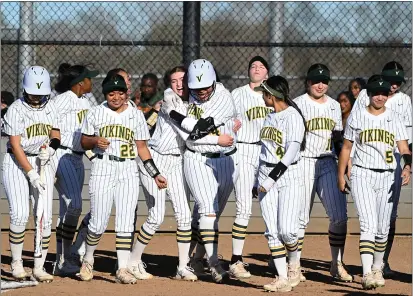  ?? CHRIS RILEY — THE REPORTER ?? Vanden's Maalia Cherry, center, is hugged by Kiah Silva as they celebrate with the team after Cherry hit her second home run in Thursday's 10-0victory against Wood.
