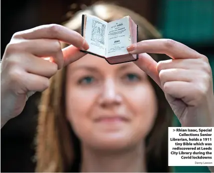  ?? Danny Lawson ?? > Rhian Isaac, Special Collection­s Senior Librarian, holds a 1911 tiny Bible which was rediscover­ed at Leeds City Library during the Covid lockdowns