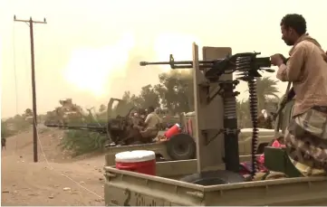  ??  ?? In this file image grab taken from a AFPTV video,Yemeni pro-government forces fire a heavy machine gun at the south of Hodeida airport, in Yemen’s Hodeida province. — AFP photo