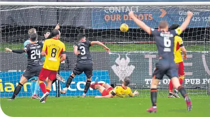  ??  ?? Dundee United’s Adrian Sporle (No.3) scores to make it 2-0