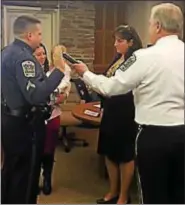  ?? PHOTO COURTESY OF UPPER PROVIDENCE TOWNSHIP ?? Newly promoted Sgt. Jeff Hilt takes the oath of office before Upper Providence Township Board of Supervisor­s’ Chairwoman Lisa Mossie and Police Chief Mark Toomey Tuesday night.