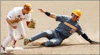  ??  ?? Texas infielder Mitchell Daly (19) forces out Tennessee’s Jordan Beck (27) to end the game during an NCAA college baseball game in the College World Series, on June 22, at TD Ameritrade Park in Omaha, Nebraska. (AP)