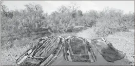  ?? Carolyn Cole/los Angeles Times/tns ?? Three plastic rafts used by smugglers to get migrants across the Rio Grande River, later confiscate­d by Border Patrol agents, on March 22, 2021, in Roma, Texas.