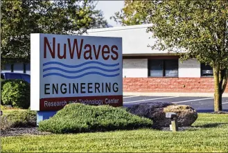 ?? NICK GRAHAM / STAFF ?? NuWaves Engineerin­g announced plans to add eight full-time equivalent jobs and invest $445,000 to expand its products and services for its growing client base throughout the Midwest. The business is located on Edison Drive in Monroe.
