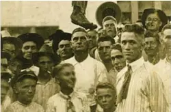  ?? UF SAMUEL PROCTOR ORAL HISTORY PROGRAM PHOTOS ?? BELOW: An Image of a lynching in Texas in 1920. Lynchings of Black people were often treated as public spectacles and even attended by children.