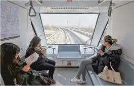  ?? — All photos by Jiang Xiaowei ?? The new line is the first automated people mover in Shanghai. Passengers in the front carriage can watch the kilometers go by from large windows.