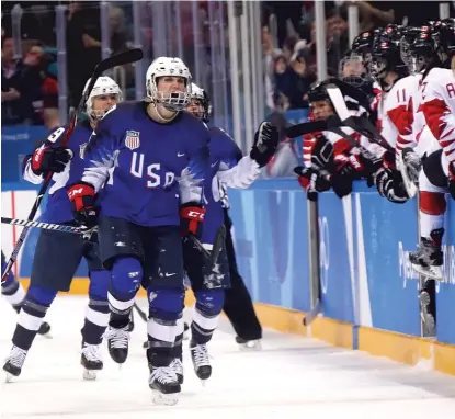  ??  ?? Monique Lamoureux- Morando celebrates her goal that tied the game at 2- 2 late in the third period.