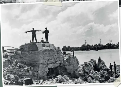  ??  ?? A US Navy Signalman, a flag in each hand waves a message to LST's (landing ship, tanks) beached at Okinawa the day after the invasion of the island on March 31, 1945.