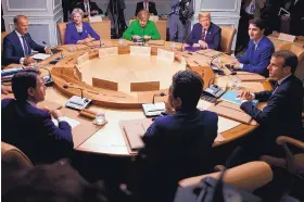  ?? EVAN VUCCI/ASSOCIATED PRESS ?? Clockwise from top left, President of the European Council Donald Tusk, British Prime Minister Theresa May, German Chancellor Angela Merkel, U.S. President Donald Trump, Canadian Prime Minister Justin Trudeau, French President Emmanuel Macron, Japanese...