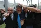  ?? FERNANDO LLANO, THE ASSOCIATED PRESS ?? Opposition lawmaker Americo De Grazia was hurt in Wednesday’s melee.