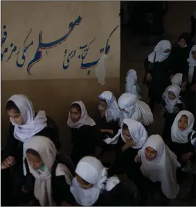  ?? (AP/Felipe Dana) ?? Girls walk upstairs Sunday as they enter a school before class in Kabul, Afghanista­n.