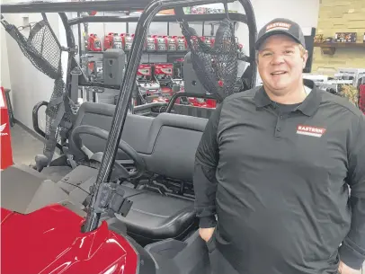  ?? DARRELL COLE • SALTWIRE NETWORK ?? Eastern Powersport­s Ltd. opened on South Albion Street in June and carries a wide variety of products from Honda, Cub Cadet, Shindaiwa, N& Trailers and Weberlane. General manager Greg Brennan stands beside a Honda side-by-side.