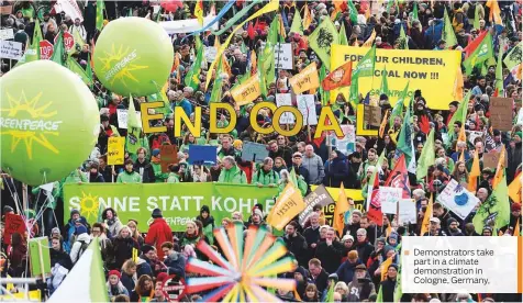  ??  ?? Demonstrat­ors take part in a climate demonstrat­ion in Cologne, Germany,