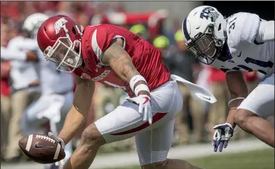  ?? NWA Democrat-Gazette/J.T. WAMPLER ?? Wide receiver Jared Cornelius drops a pass during Arkansas’ loss to TCU on Sept. 9. Through two games, the Razorbacks rank 116th nationally in passing offense and 56th in rushing offense.