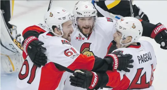  ?? THE ASSOCIATED PRESS ?? Bobby Ryan, centre, celebrates his winning goal against the Penguins. On Mother’s Day Ryan was without his mom, who died last summer.