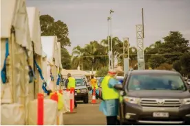  ?? Photograph: Courtesy of Sunraysia Daily ?? A pop-up Covid testing site at Sarah Oval in Mildura in north-west Victoria. A man who had attended the footy game at Melbourne’s MCG with a positive Covid case visited the Mildura Base Public hospital and later tested positive himself.