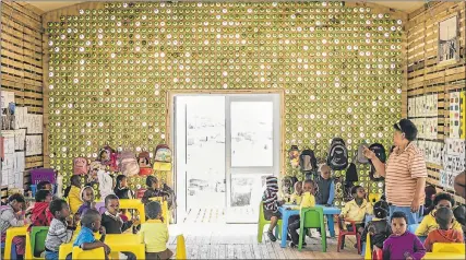  ?? Pictures: JOUBERT LOOTS ?? BRIGHT IDEAS: Children are kept busy at the Silindokuh­le creche in Port Elizabeth’s Joe Slovo township which has been nominated for a design award