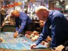  ?? WAYNE PARRY - THE ASSOCIATED PRESS ?? This April 20, 2018 photo shows a game of craps underway at Resorts Casino Hotel in Atlantic City, N.J. As Atlantic City’s casinos mark their 40th anniversar­y, the industry is hailing the reopening of two of the five casinos that shut down since 2014,...