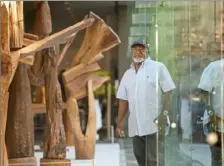  ?? Steve Mellon/Post-Gazette ?? North Side sculptor Thaddeus Mosley with some of his massive wood sculptures that are included in the 57th Carnegie Internatio­nal at the Carnegie Museum of Art in Oakland. This photo was taken in October 2018, shortly before the exhibition opened.