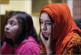  ?? B.K. BANGASH — THE ASSOCIATED PRESS ?? Shahnaz, 16, right, and Shakeela, 12, daughters of Mir Aman, speak to The Associated Press, in Islamabad, Pakistan.