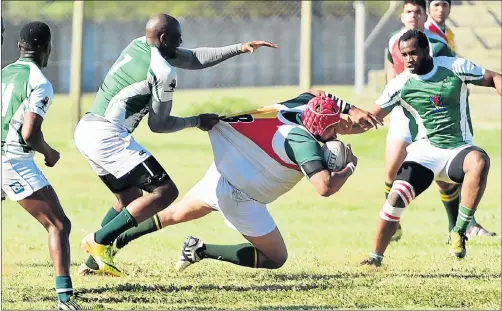  ?? Picture: EUGENE COETZEE ?? TOUGH MOVES: Spring Rose flank Lizwi Maxhele brings down Harlequins No 8 Elvino Koetaan during their Mayoral Cup rugby match