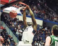  ?? Stephen Dunn / Associated Press ?? UConn’s Adama Sanogo dunks during the second half against Binghamton on Saturday.