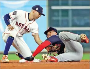  ??  ?? Juan Soto of the Washington Nationals steals second base against Carlos Correa of the Houston Astros during the eighth inning in game one of the 2019 World Series at Minute Maid Park on Tuesday in Houston, Texas.