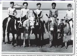  ?? ?? Children at the Derbyshire Children’s Holiday Centre enjoy a donkey ride on the beach at Skegness in 1975