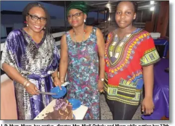  ??  ?? L-R: Mum, Nkem, her cretive director, Mrs. Nkoli Ogbolu and Nkem while cutting her 13th birthday...recently